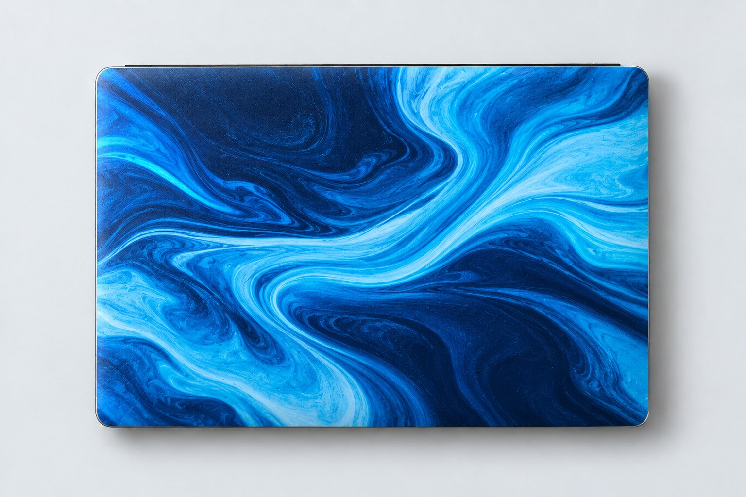 Concept laptop with a blue wave vinyl skin